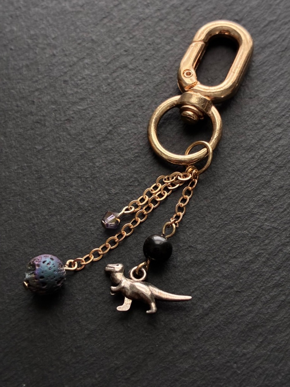 Gold Dinosaur Charm Keychain with Purple and Black Beads